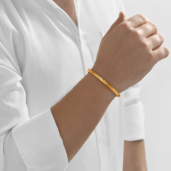 https://www.moneymetals.com/images/products/32.4grams-gold-bangle-embelished-tribal-model-male.jpg