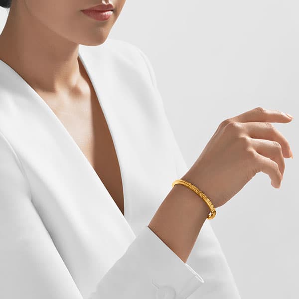 https://www.moneymetals.com/images/products/32.4grams-gold-bangle-embelished-tribal-model.jpg