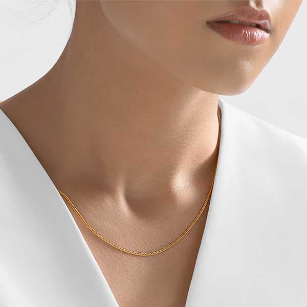 https://www.moneymetals.com/images/products/4grams-1-3mm-flat-gold-chain-curb-female-model.jpg